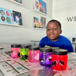 Preston Makes Dinosaur Lanterns at Wine & Design Montclair Art Camp