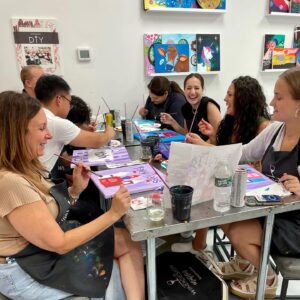Coworkers Laugh at Lot at Wine & Design Montclair Team Building