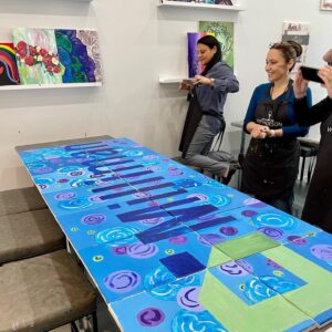 Milliman Company Logo in Full Mosaic Painting at Wine & Design Montclair