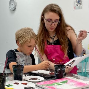 Meggs Helps a Young Artist with His Star Wars Inspired Painting