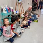 Granddad is Playing Telephone with the Kids at Mini Matisse Art Camp Wine & Design Montclair